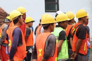 construction workers risk management meeting